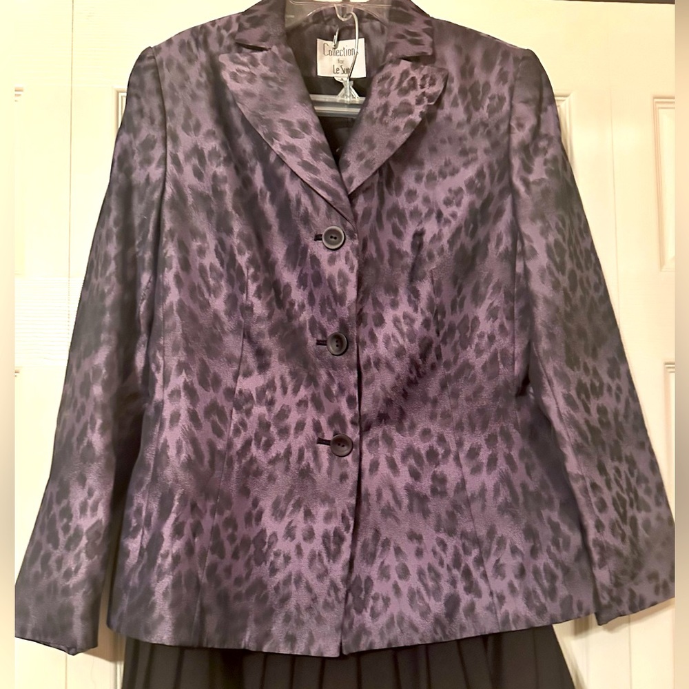 LaSuit, purple print with black A-line skirt, pleats at the bottom 3 to 4 inches